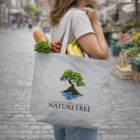 Woman carrying a Vista Polycotton Tote Bag with groceries, including bread and peppers.