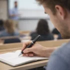 Student taking notes with Twist Pens during a classroom lecture.