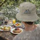 Wearing an Edgy Bucket Hat at an outdoor table with pancakes, toast, fruit, and drinks.