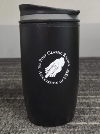 Black travel mug with Post Classic Racing Association logo—perfect for event gifts or accessories.