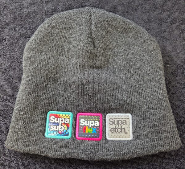 Gray knit beanie with colorful patches—great for advising clients on choosing similar products.