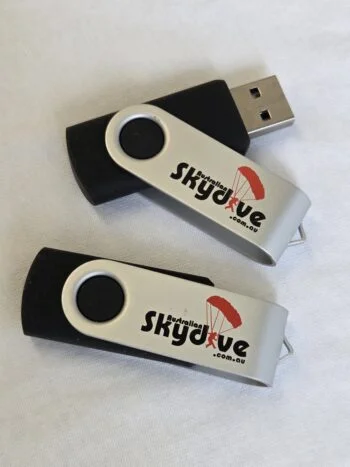Two Cap USB Drives with Skydive Australia logos and red parachute graphics.