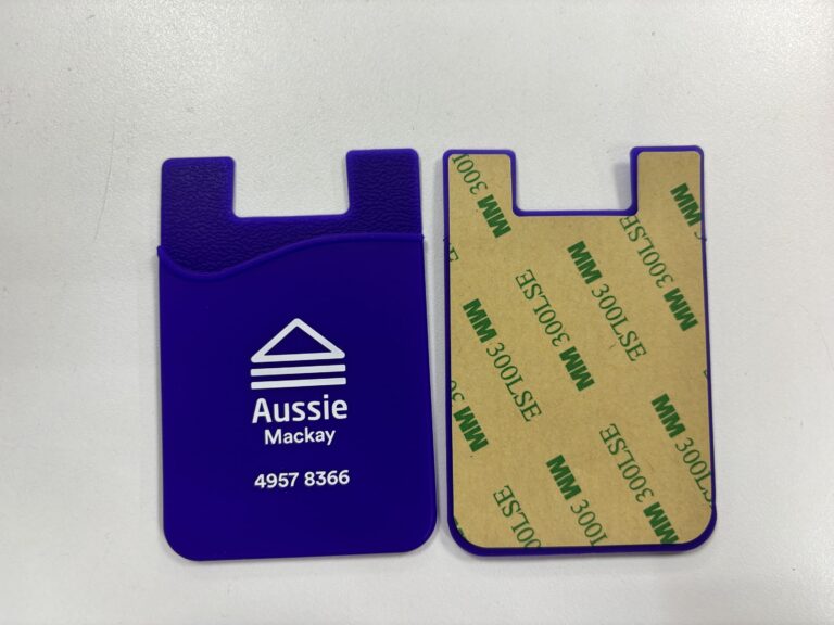 Two blue silicone card holders, perfect event accessories or event gift ideas, with logo and adhesive back.