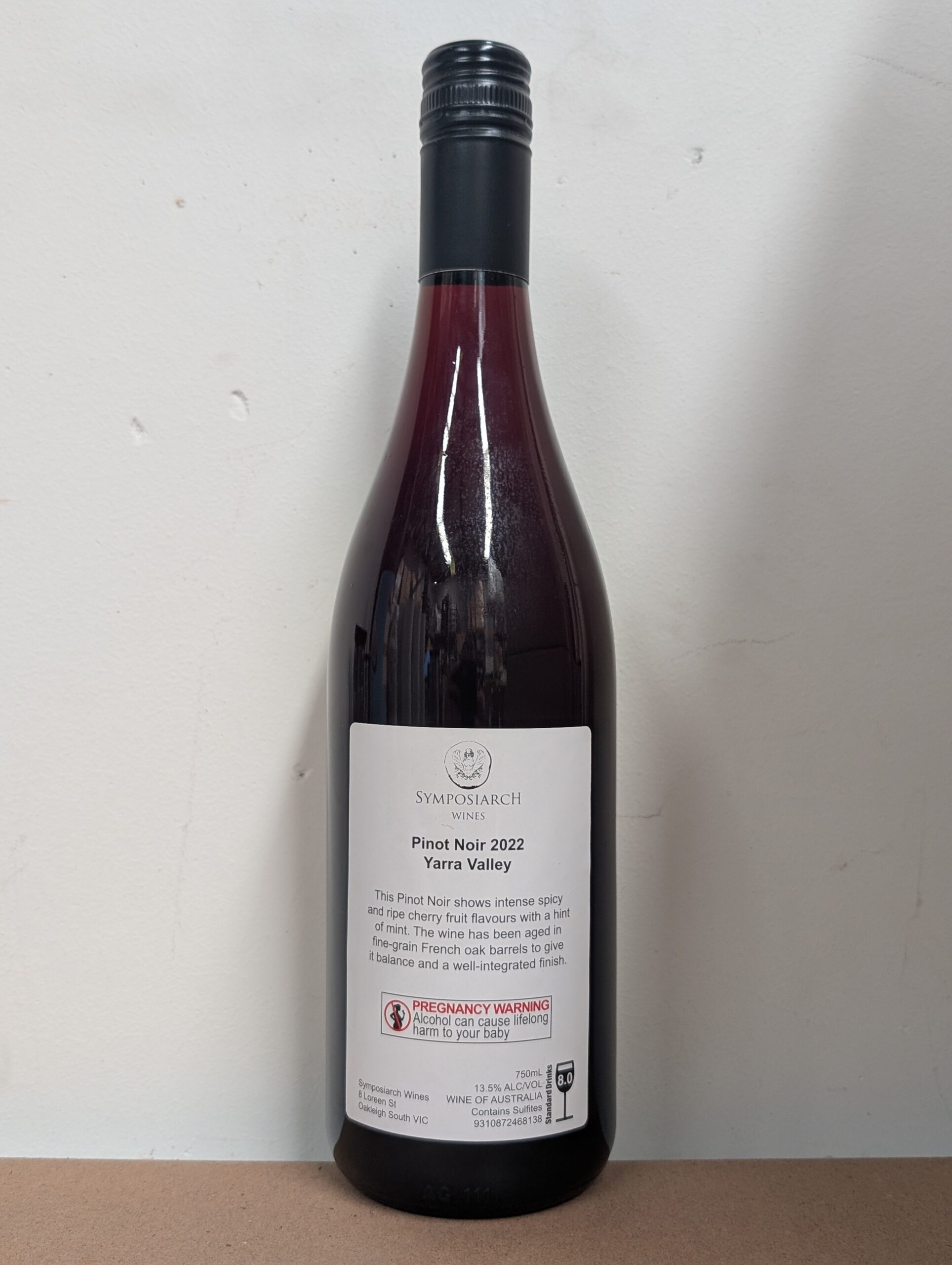 A bottle of Symposiarch Pinot Noir 2022 with a white label, perfect for Perth evenings.