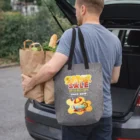 Man in Brighton loads groceries into car with a Brighton RPET Gusset Tote Bag featuring graphics.