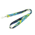 A lanyard with a metal clip featuring a Starry Night-inspired design in blue and yellow.