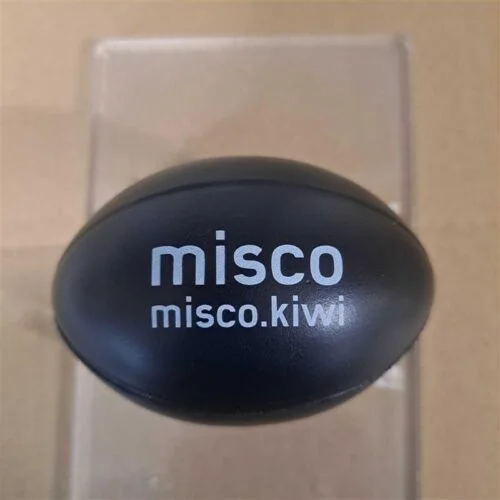 Black oval event item with misco misco.kiwi printed in white text on its surface.
