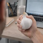 Relieve stress at your desk with the Stress Balls - Garlic while working on your laptop.