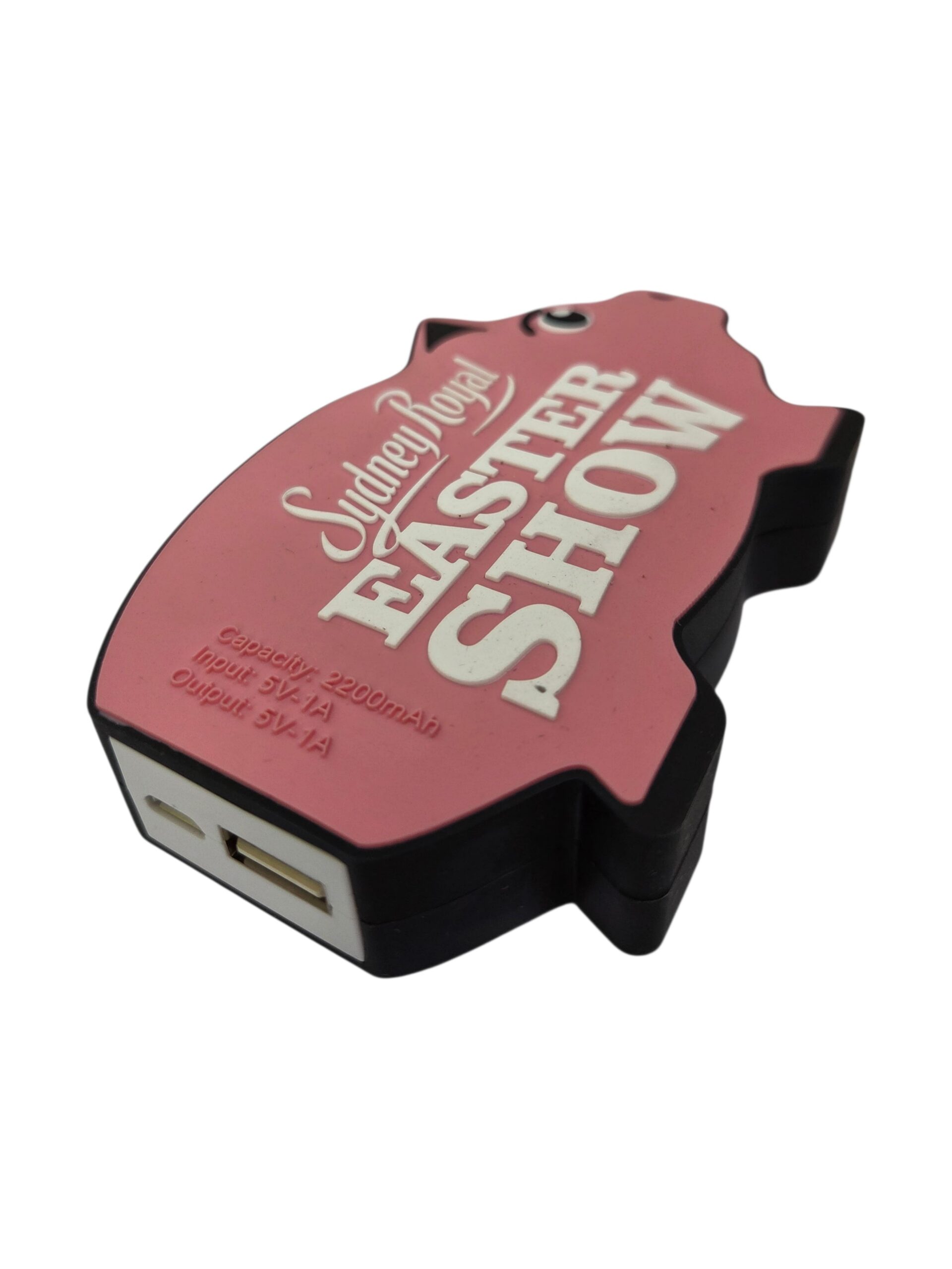 Pink, pig-shaped power bank with Sydney Royal Easter Show written on the top.