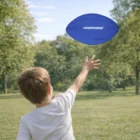 A child catches a Toys 200Mm Ball and other toys in a sunny park.