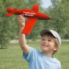 Smiling boy holds Glider Plane Toys; text: “COMES LOGO BRANDED.”.