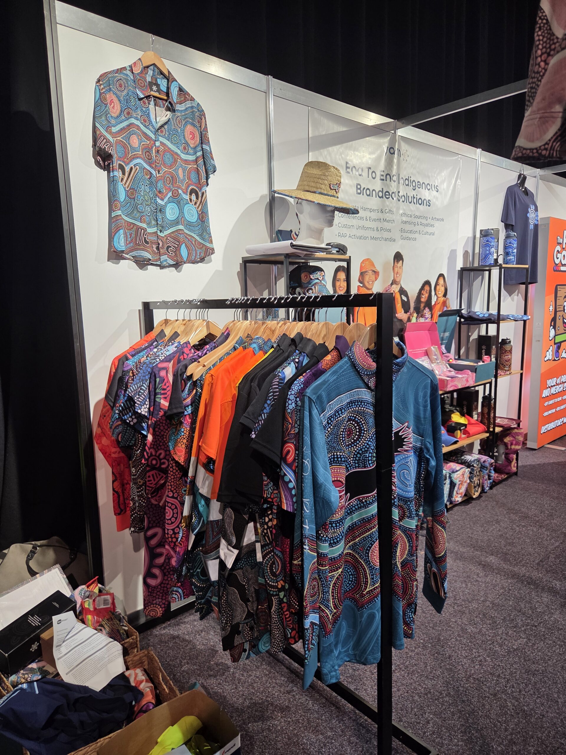 Colorful patterned shirts displayed on racks, perfect for event inventory at multi-day events.
