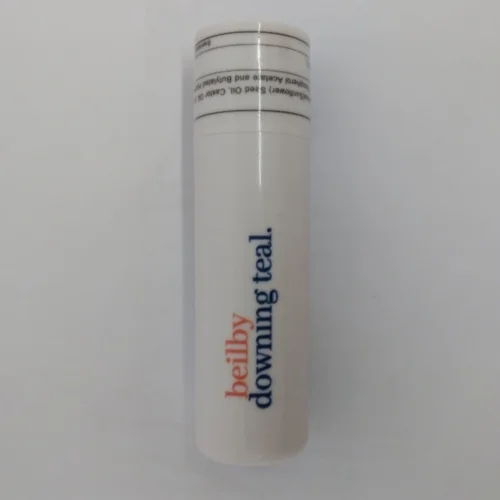 A white cylindrical tube labeled beilby downing teal to minimise clean-up at large gatherings.