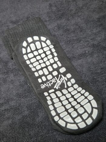 Gray sock with white non-slip grip and Active text, perfect for adding your logo in EPS format.