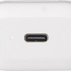 Close-up of a white wireless earbud case with a USB-C charging port and tiny indicator light.