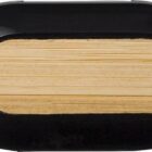 A black rectangular pencil sharpener with a wooden pencil shaving inside.