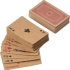 A stack of playing cards and a fanned hand showing various suits, including a joker.