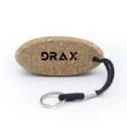 Oval cork keychain with DRAX logo, black cord, and metal keyring on white background.