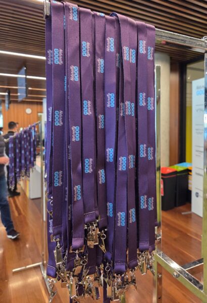 Purple lanyards with Festival of Good text, explained for buyers and Minimum Order Quantities.