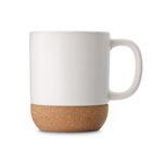 White ceramic mug with a cork bottom, placed against a plain white background.