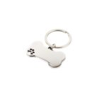 Silver bone-shaped keychain with a small paw print cutout on the left side.