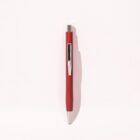 Red and silver ballpoint pen placed vertically on a white background.