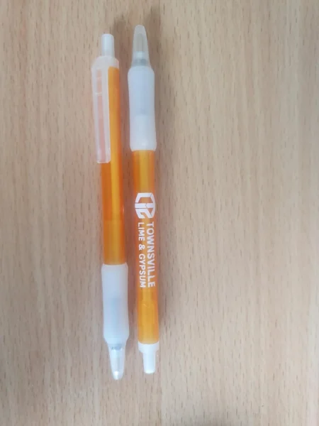 Two orange pens with white caps—perfect no size selection gifts for any occasion.