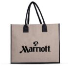 Beige tote bag with black handles and the Marriott logo in black on the front.