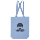 Light blue tote bag with Hawthorn Hotel & Suites and a tree logo printed in black.