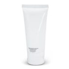 White tube of sunscreen lotion with minimal text on the front, standing upright on a white background.