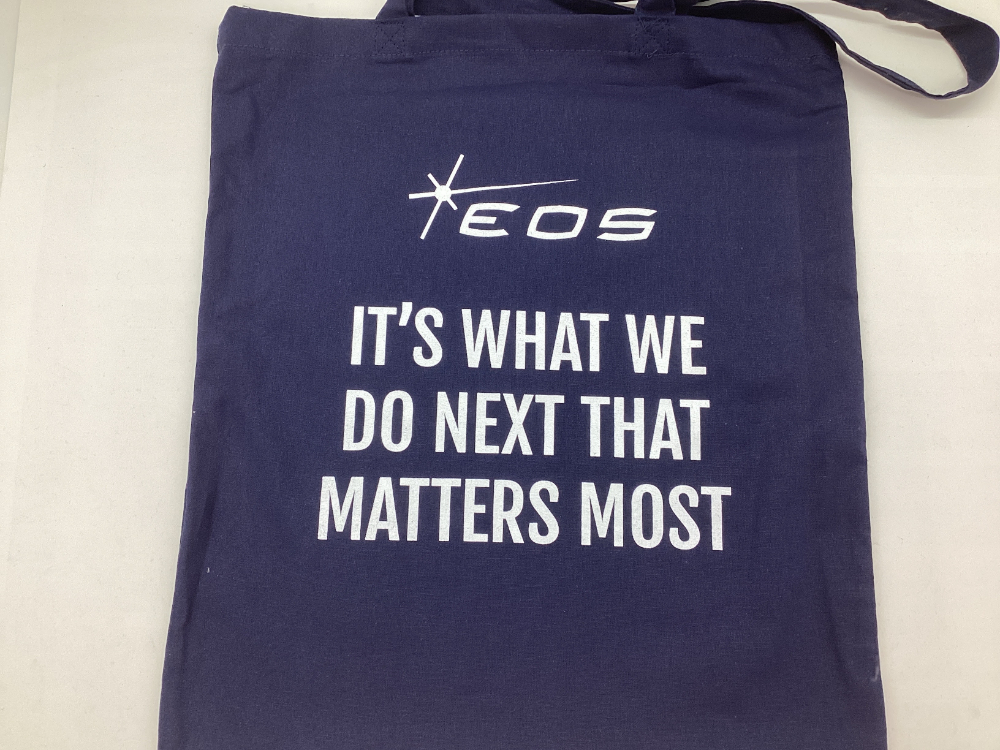 Dark blue tote bag with the EOS Defense Systems logo, inspired by Canberra innovation.