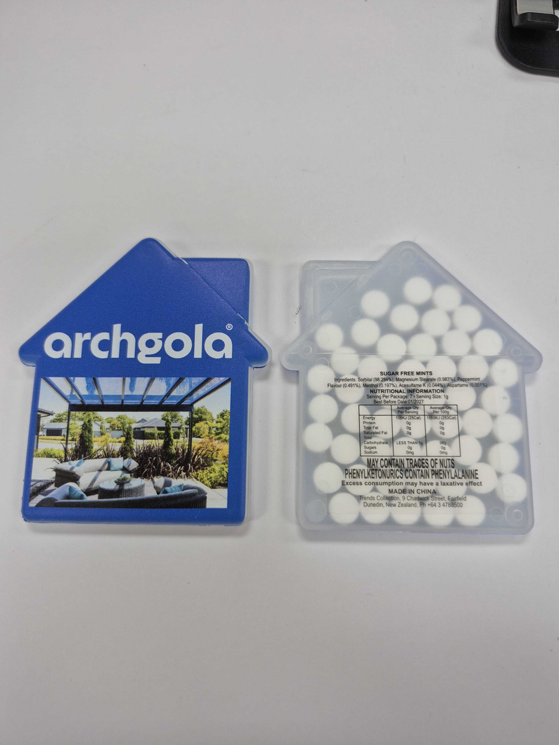 Two house-shaped containers—one labeled Archgola, one with mints for a satisfied client.