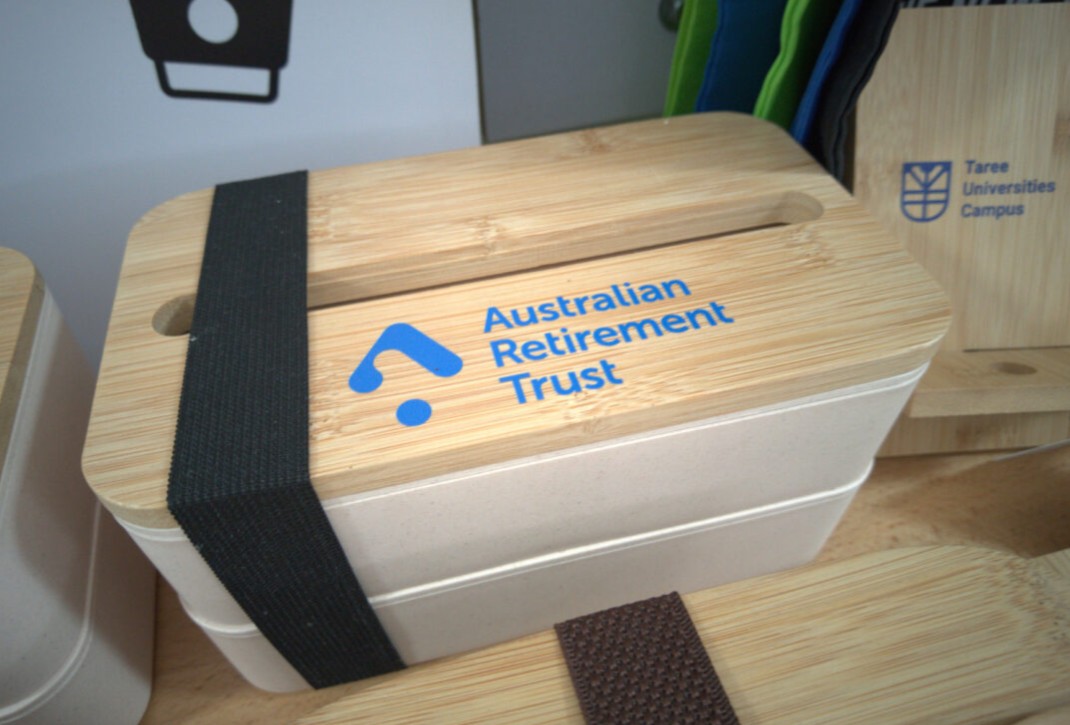 A bamboo lunchbox from trusted bamboo suppliers, with Australian Retirement Trust on the lid.