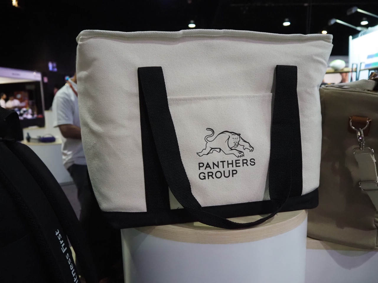 White tote bag with Panthers Group logo, ideal for wholesale purchasing and bulk order benefits.