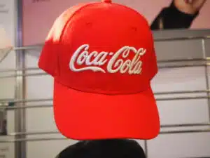 red cap with coca cola logo