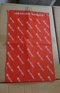 red mail package printed with balmain logo