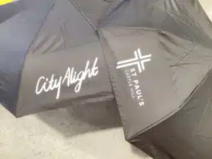 black umbrellas printed with logo