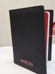 black notebook with logo printed
