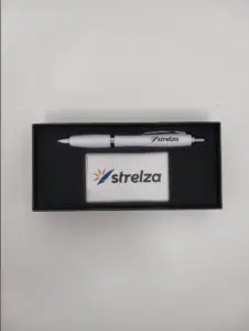 pen and mints on the gift box with logo