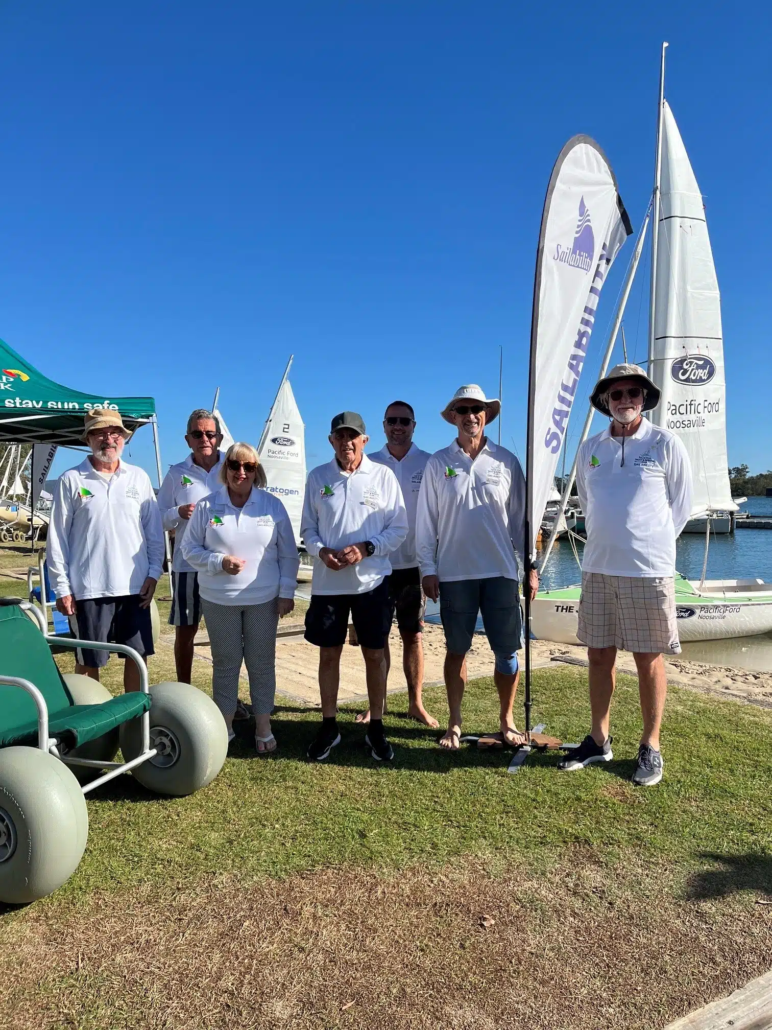 Noosa Yacht and Rowing Club Sailability volunteers in embroidered polos