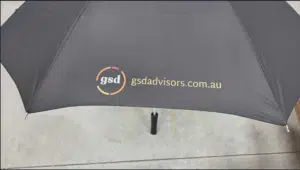 black umbrella printed with logo