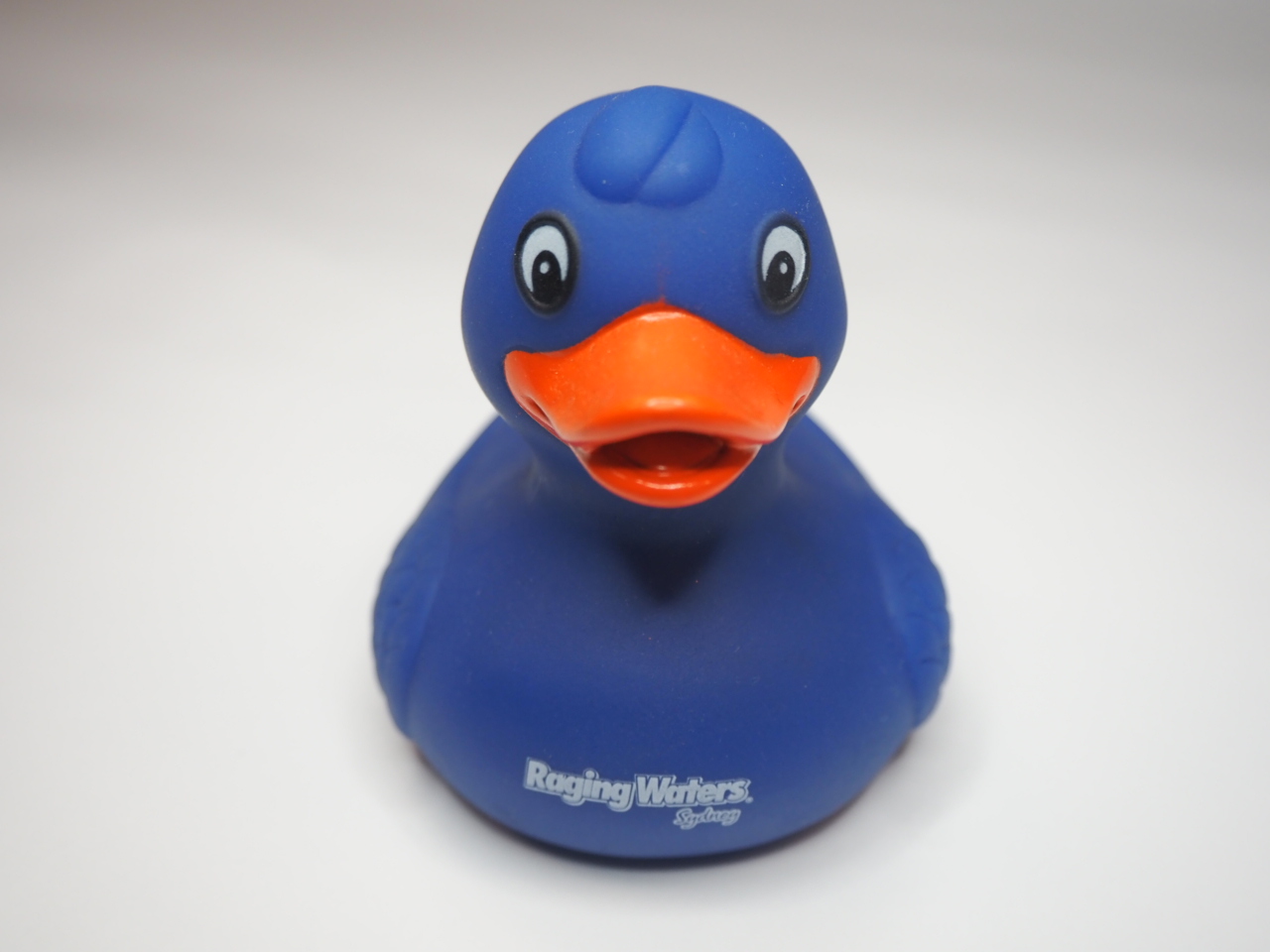 blue rubber duck with logo on the chest