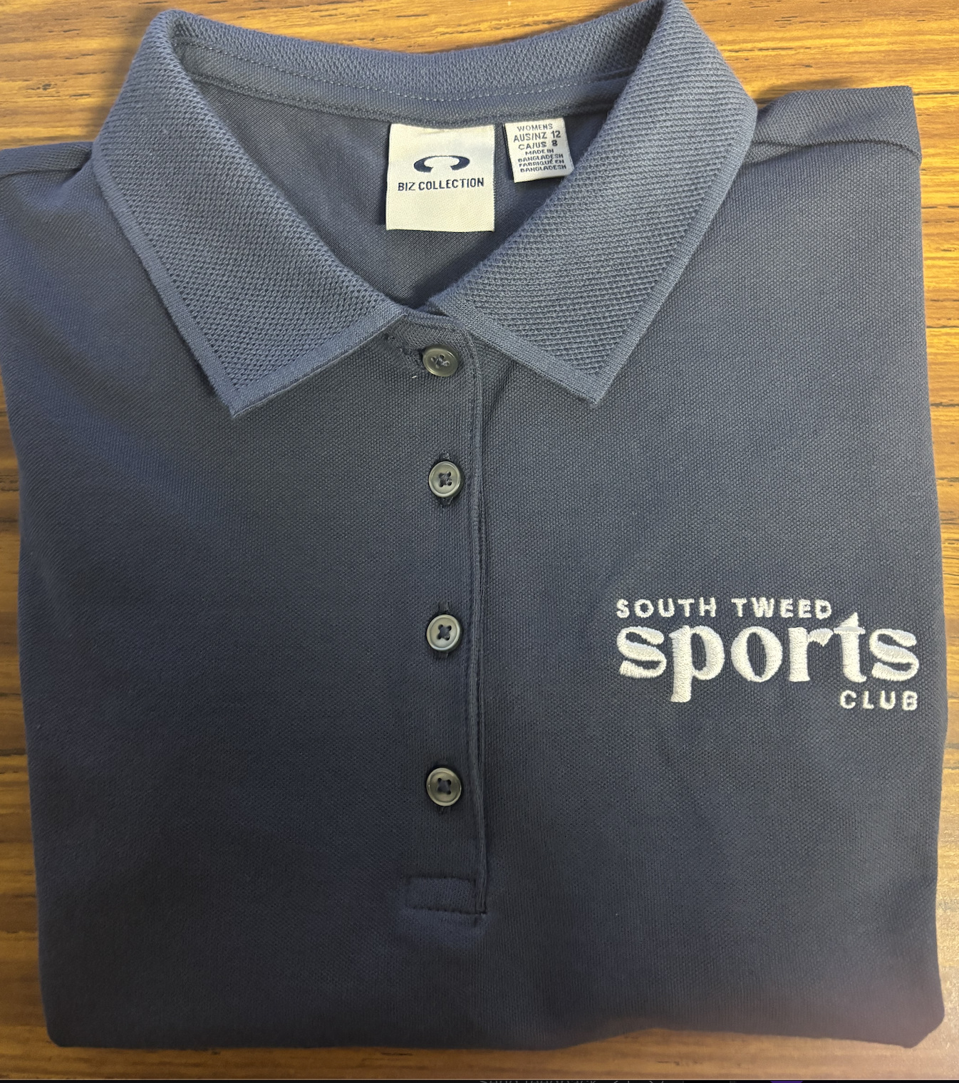 grey polo shirt with logo