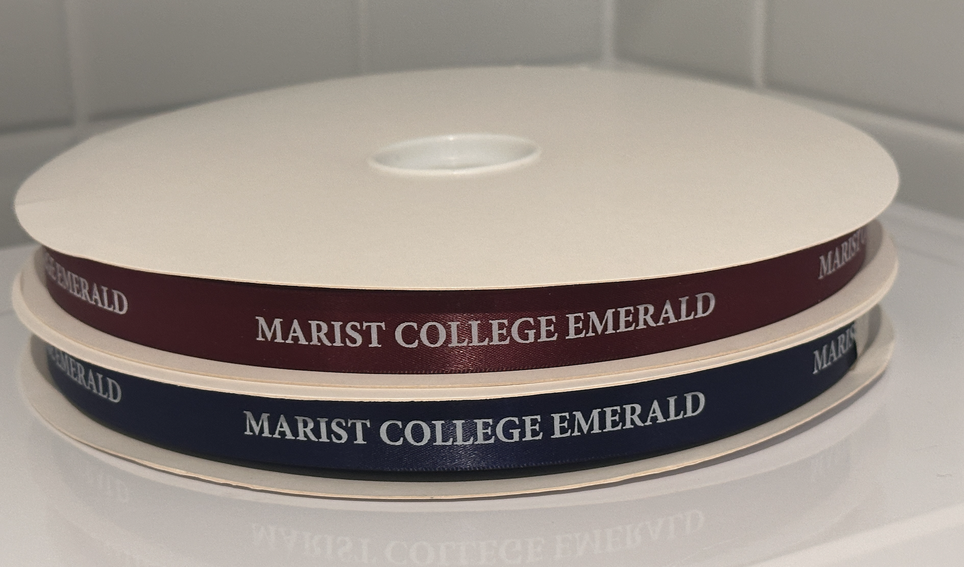 blue and red ribbons with marist logo