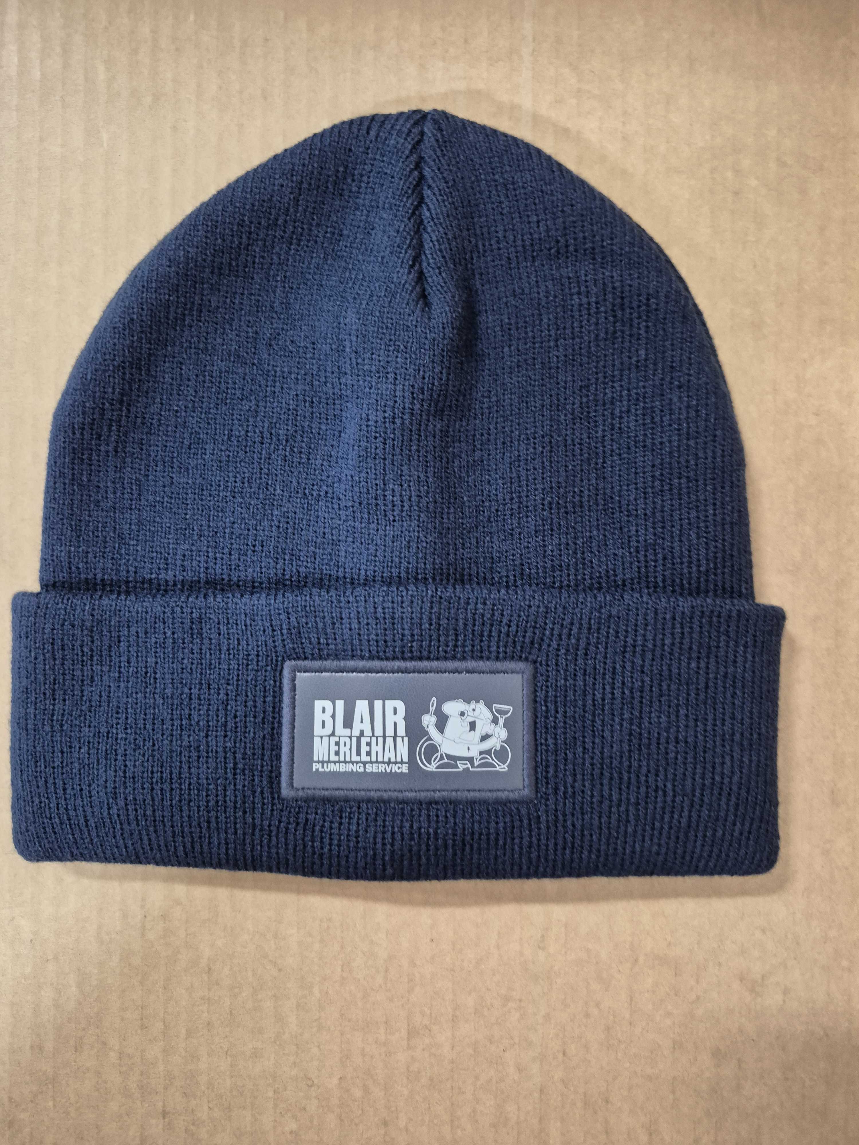 navy blue beanies with blair merlehan plumbing logo