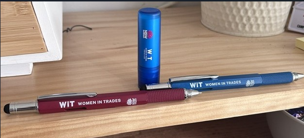 pens and lip balms on a table