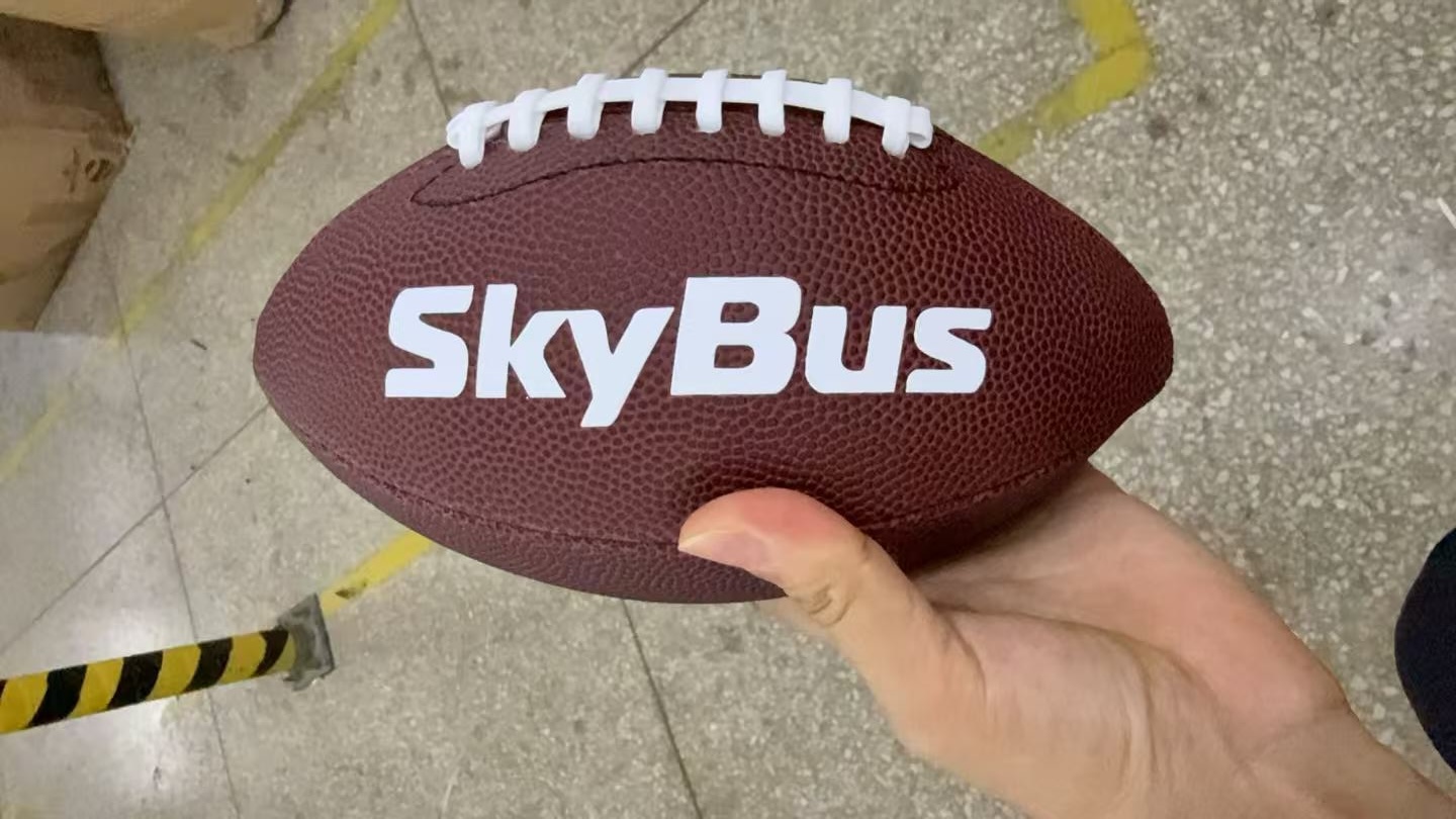 branded american footballs with Skybus logo printed