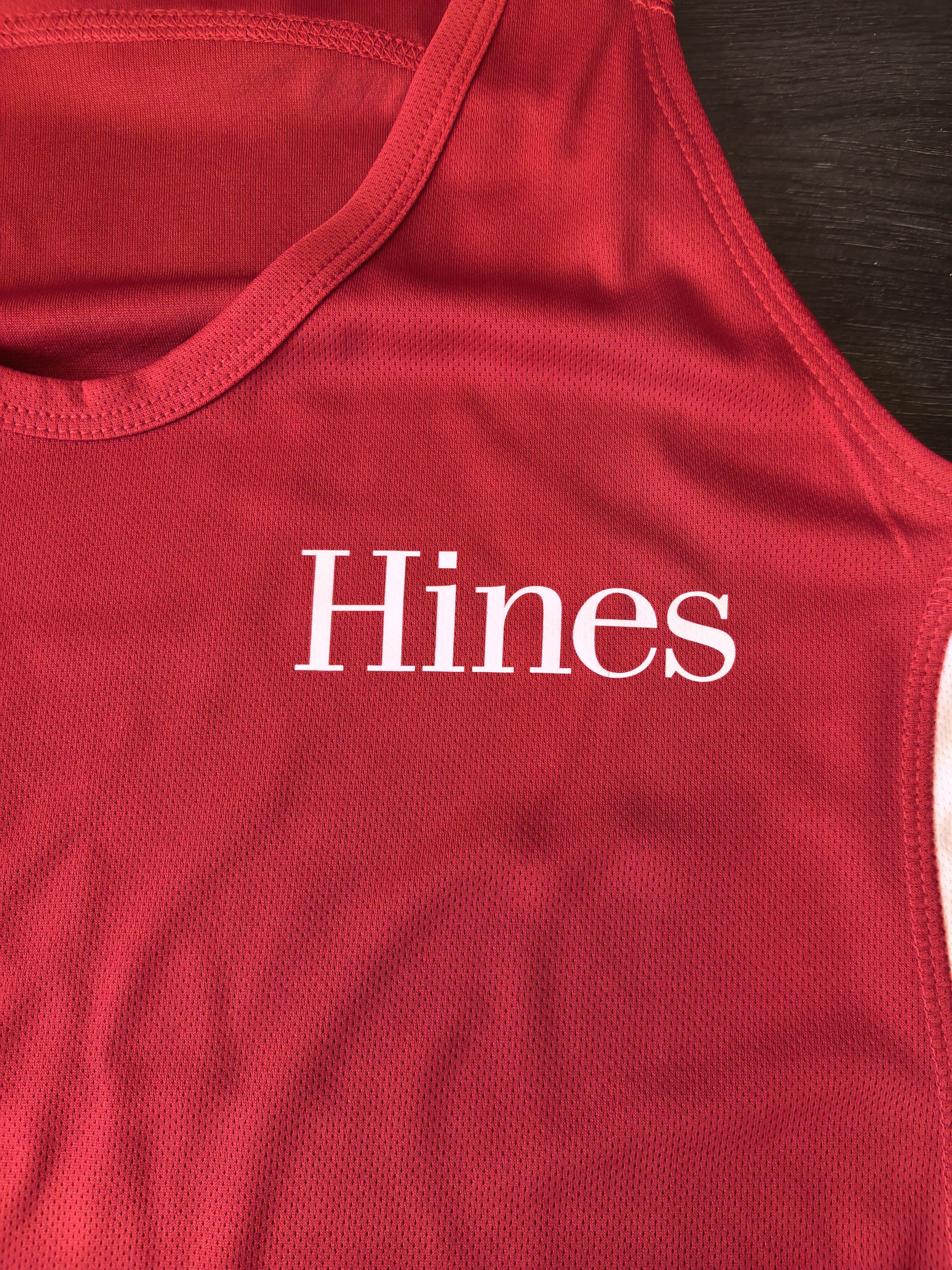 red singlet with a hines logo