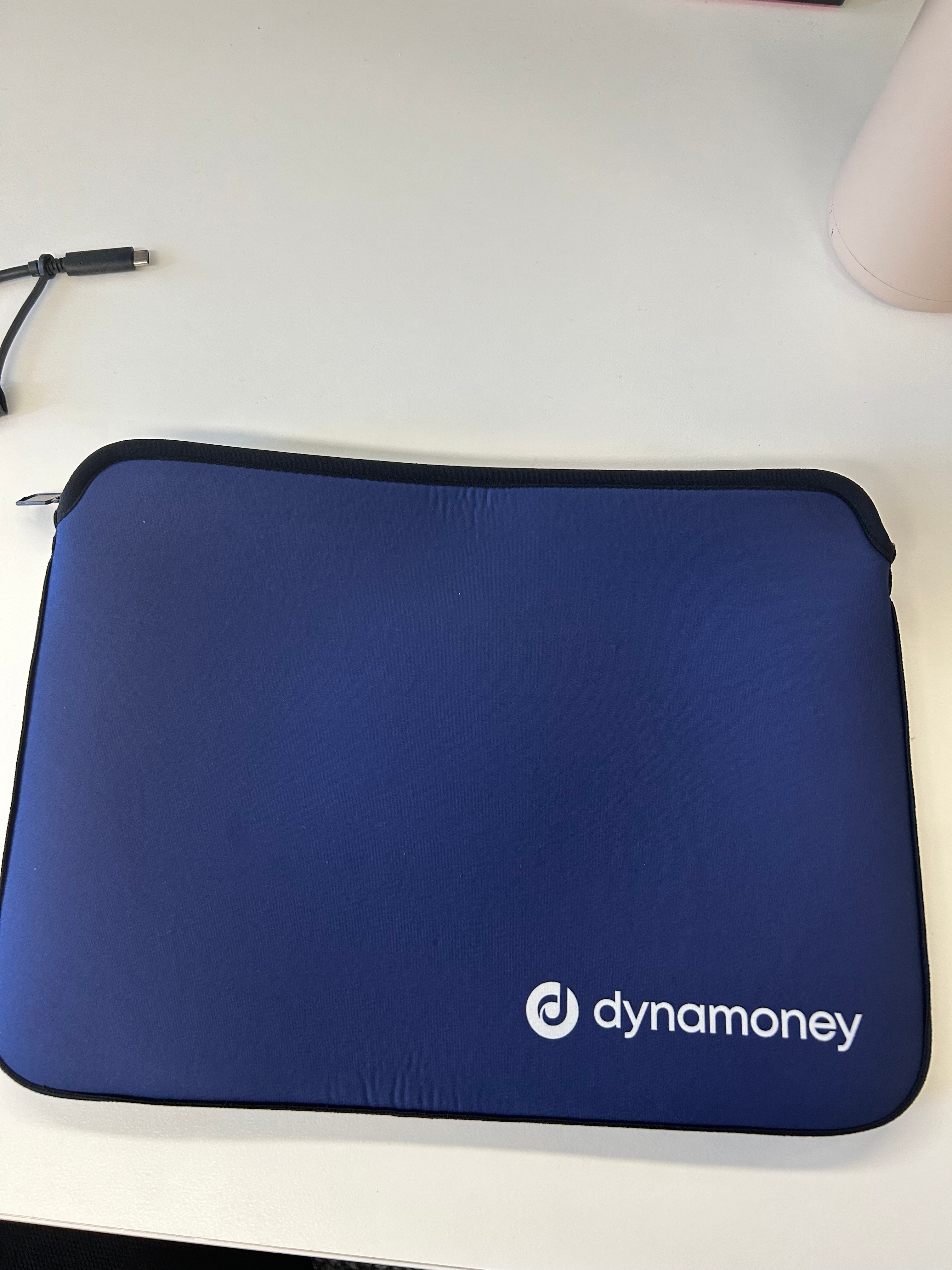 blue laptop bag customised with the dynamoney logo