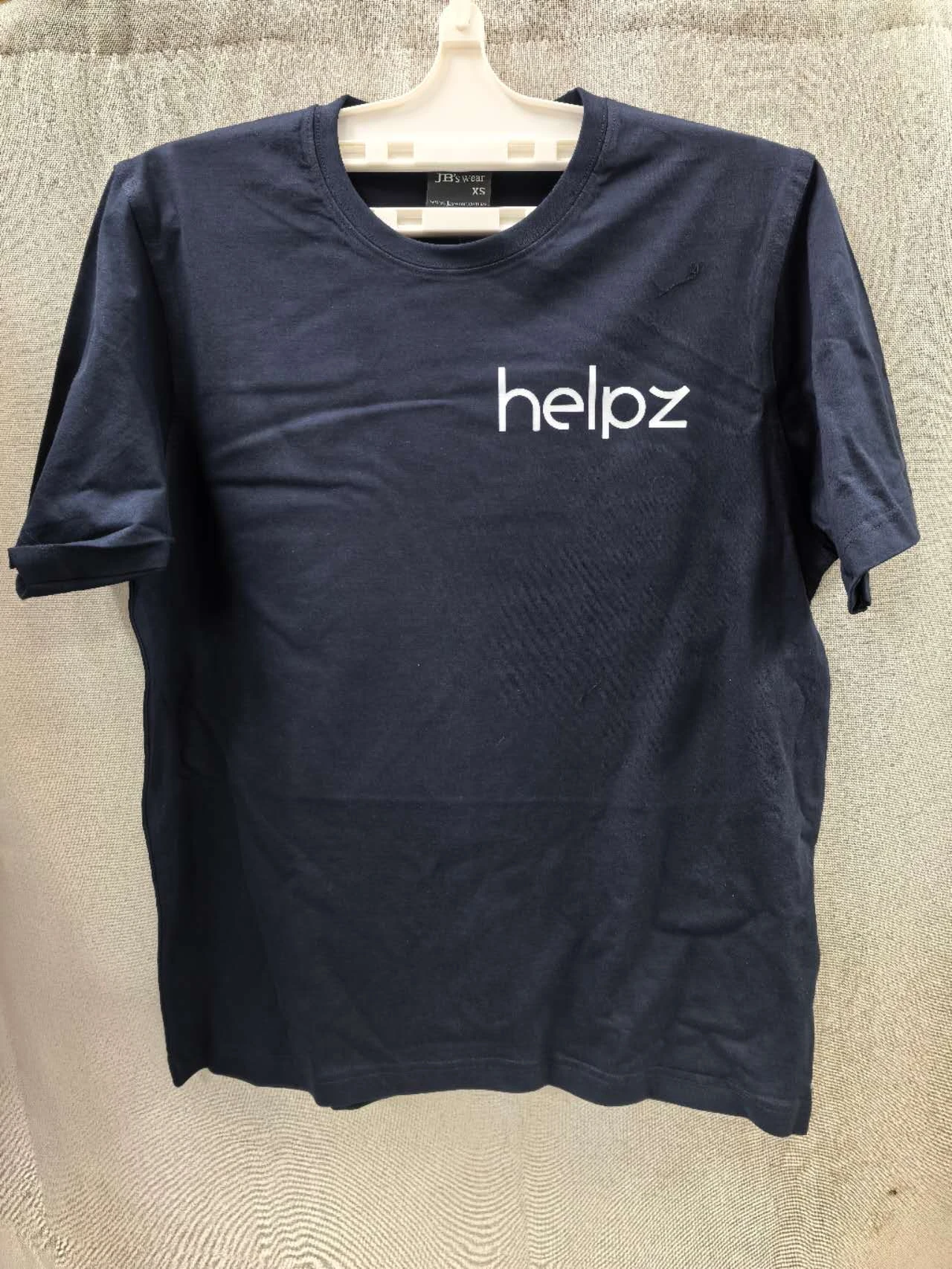 black shirt branded with white helpz logo